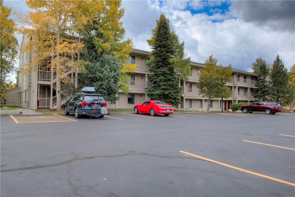 4811 Ryan Gulch Road, Unit 4811 Silverthorne, CO 80498 - Photo 28 of 35 a car parked in front of a building