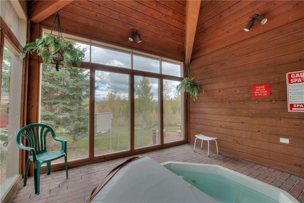 4811 Ryan Gulch Road, Unit 4811 Silverthorne, CO 80498 - Photo 33 of 35 a balcony with table and chairs