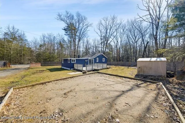 a view of a yard with trees