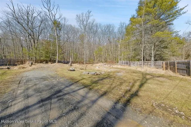 a backyard of apartments with trees