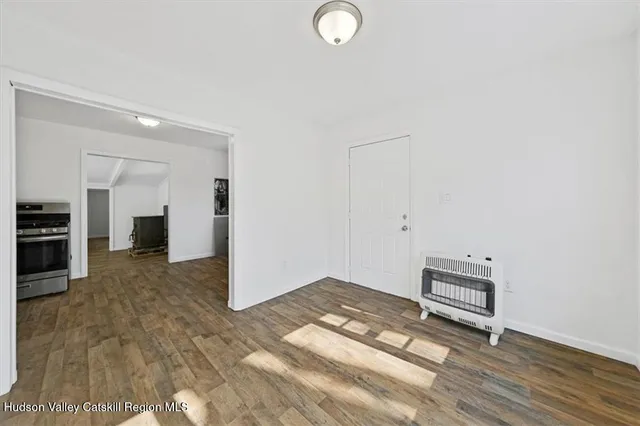 a view of a livingroom with wooden floor