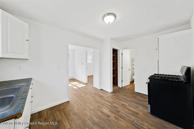 a view of a storage & utility room with wooden floor