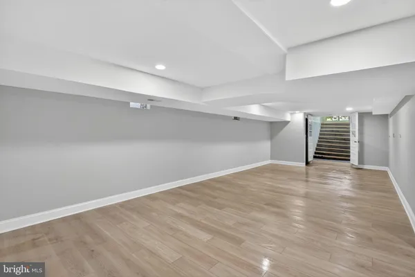 a view of a entryway with wooden floor and stairs