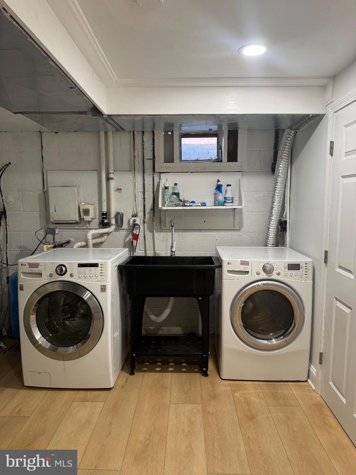 511 Sylvan Way Pasadena, MD 21122 - Photo 44 of 44 Modern laundry space with sleek appliances.