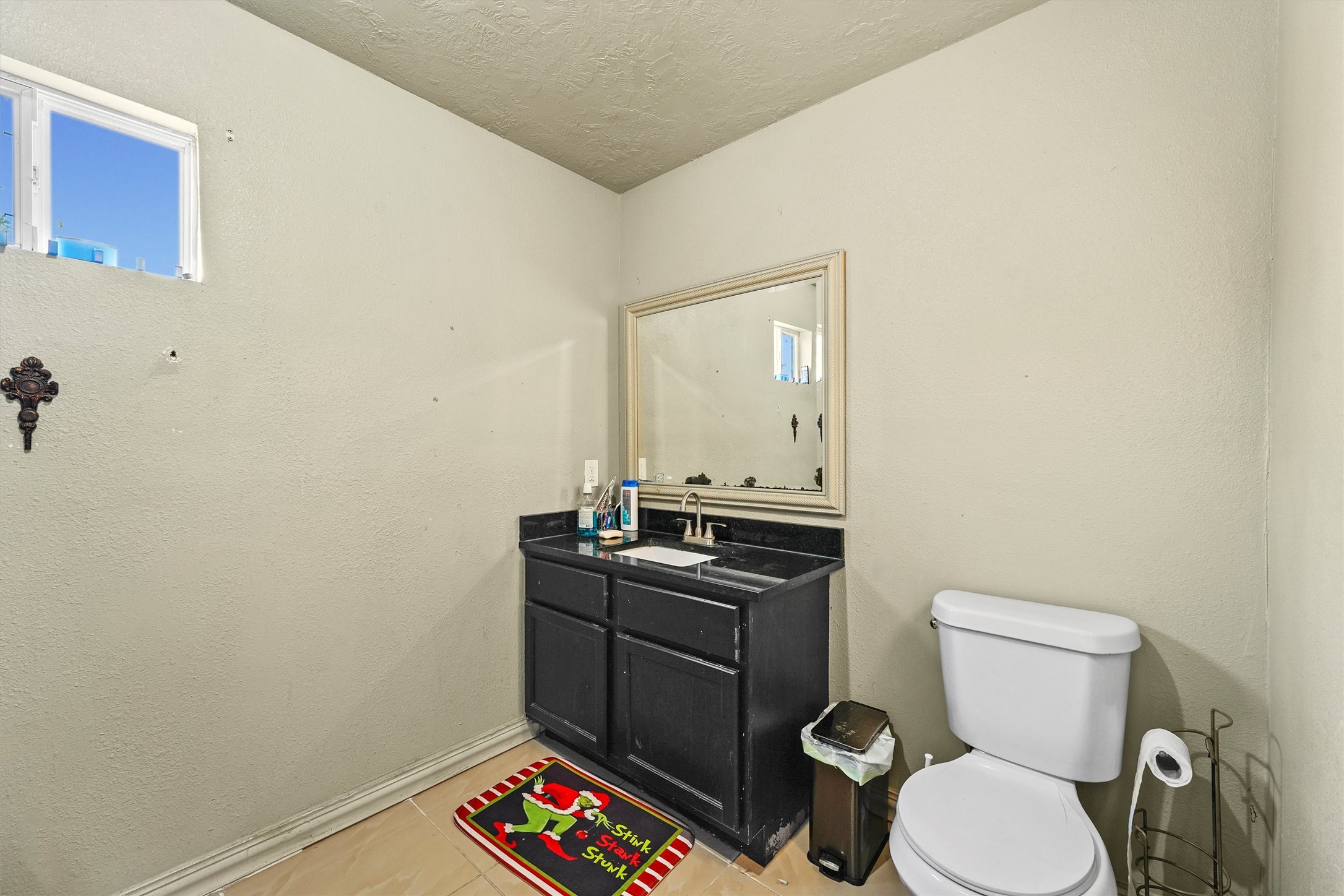 4322 Bennington Street Houston, TX 77016 - Photo 12 of 26 a bathroom with a toilet and a sink