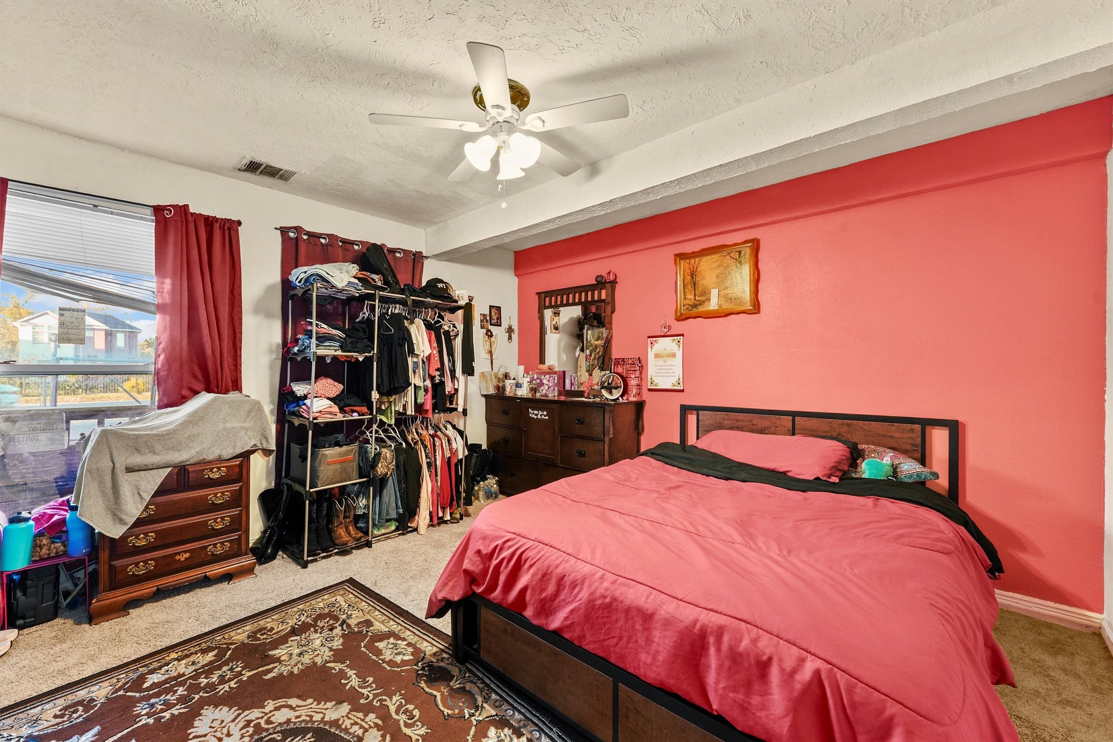 4322 Bennington Street Houston, TX 77016 - Photo 14 of 26 a bed room with a bed and a walk in closet