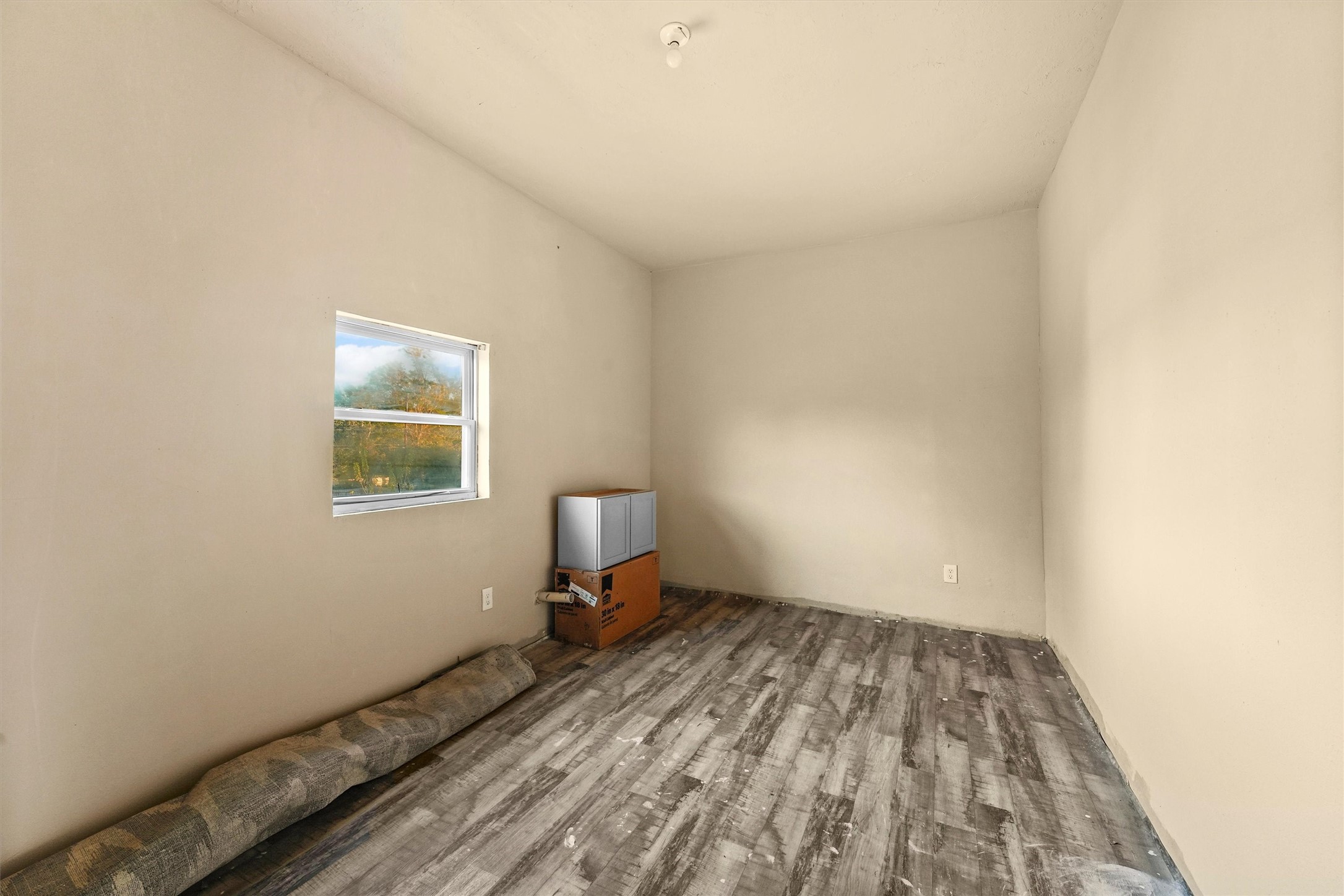 4322 Bennington Street Houston, TX 77016 - Photo 20 of 26 a view of small space with wooden floor and fan