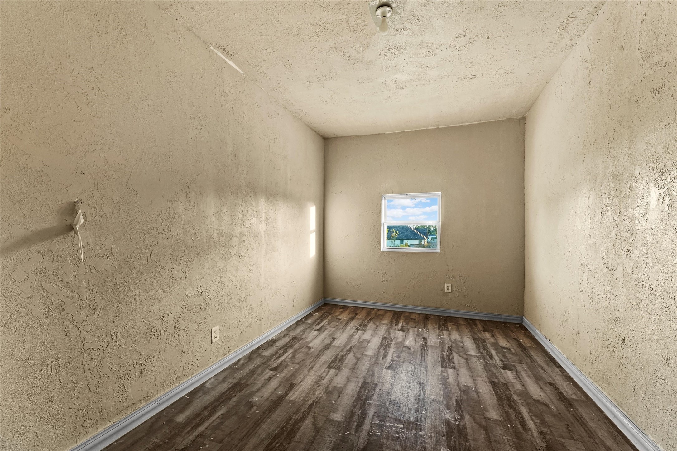 4322 Bennington Street Houston, TX 77016 - Photo 21 of 26 a view of room with window and hardwood floor