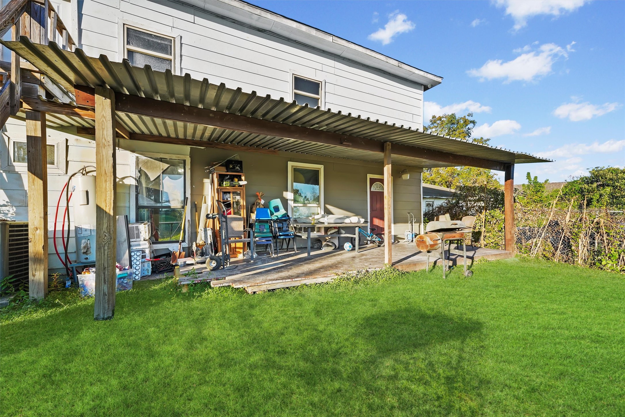 4322 Bennington Street Houston, TX 77016 - Photo 25 of 26 a view of a chairs and table in a big yard