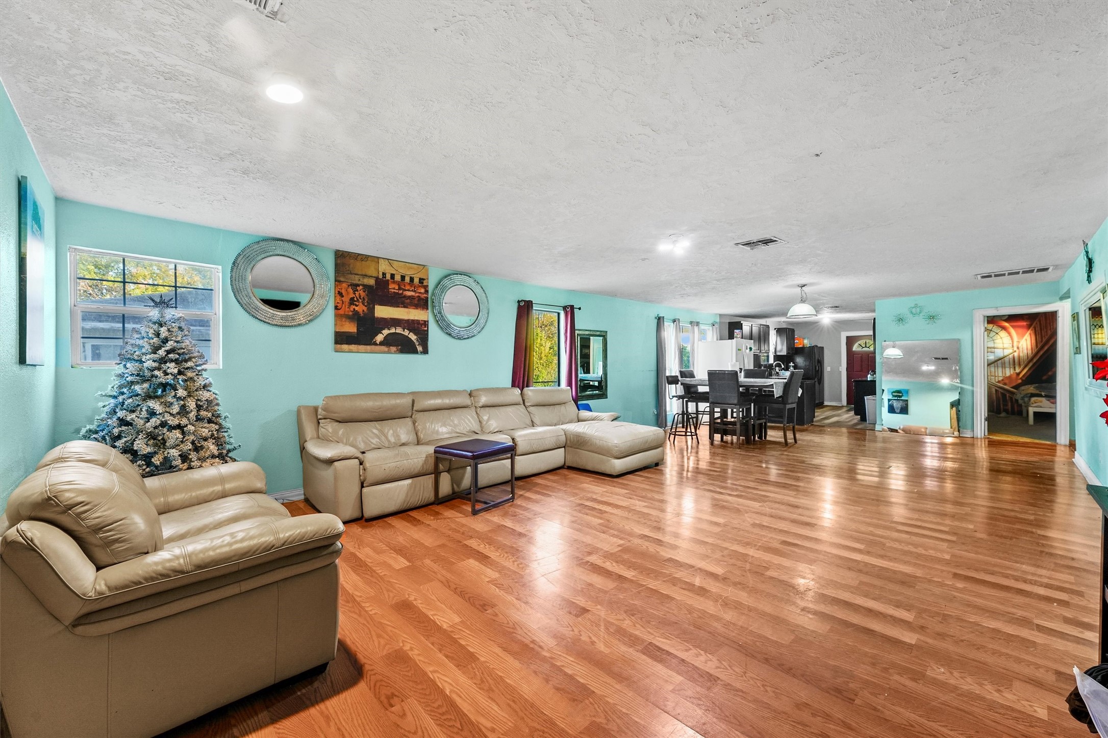 4322 Bennington Street Houston, TX 77016 - Photo 3 of 26 a living room with furniture and wooden floor
