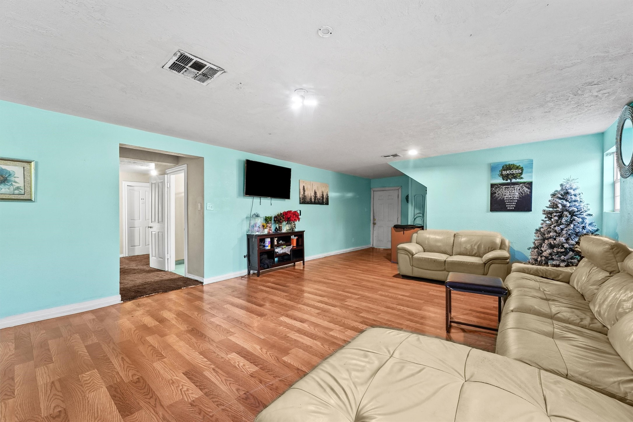 4322 Bennington Street Houston, TX 77016 - Photo 4 of 26 a bedroom with furniture and a flat screen tv