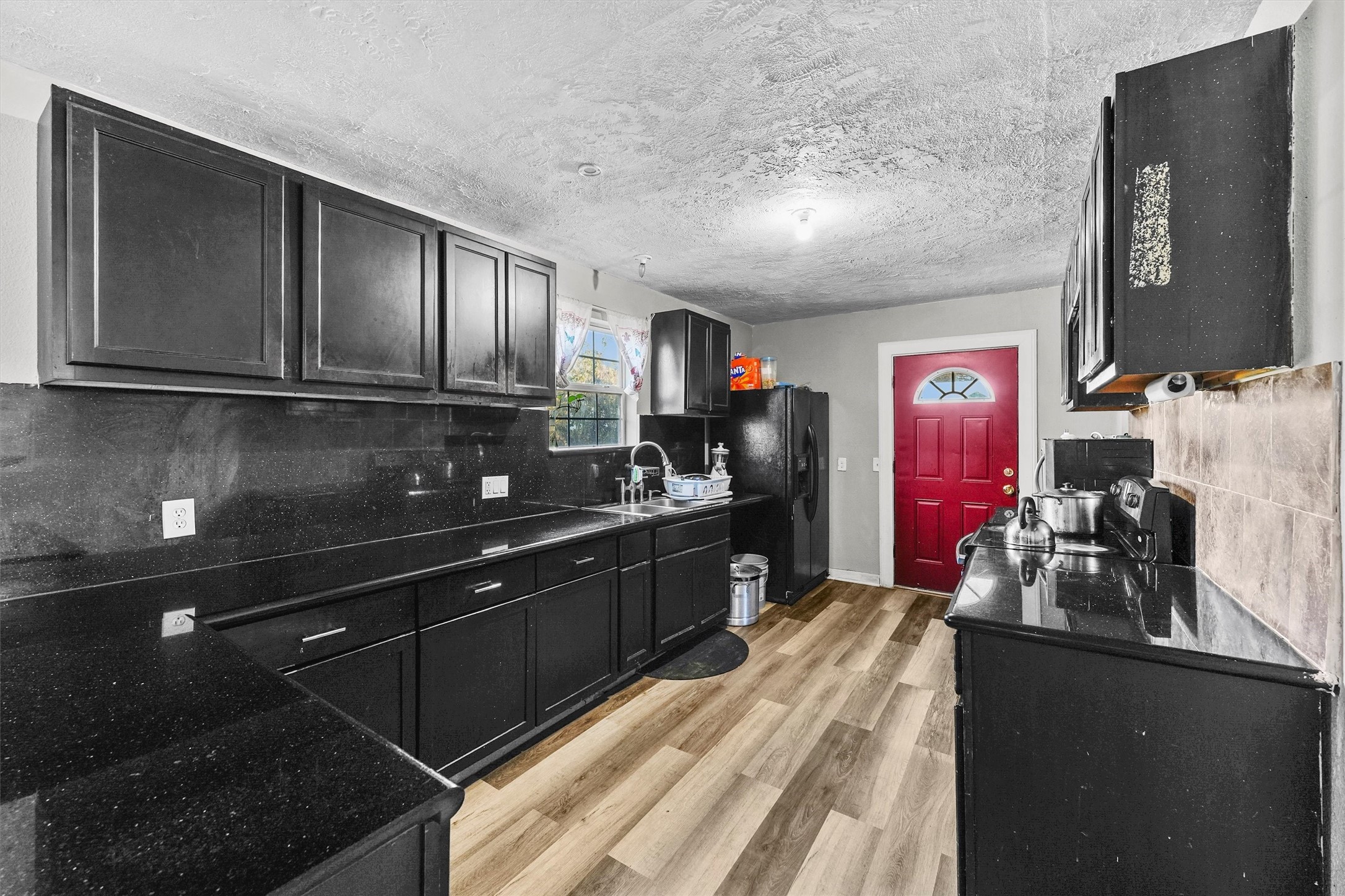 4322 Bennington Street Houston, TX 77016 - Photo 6 of 26 a kitchen with granite countertop lots of counter top space