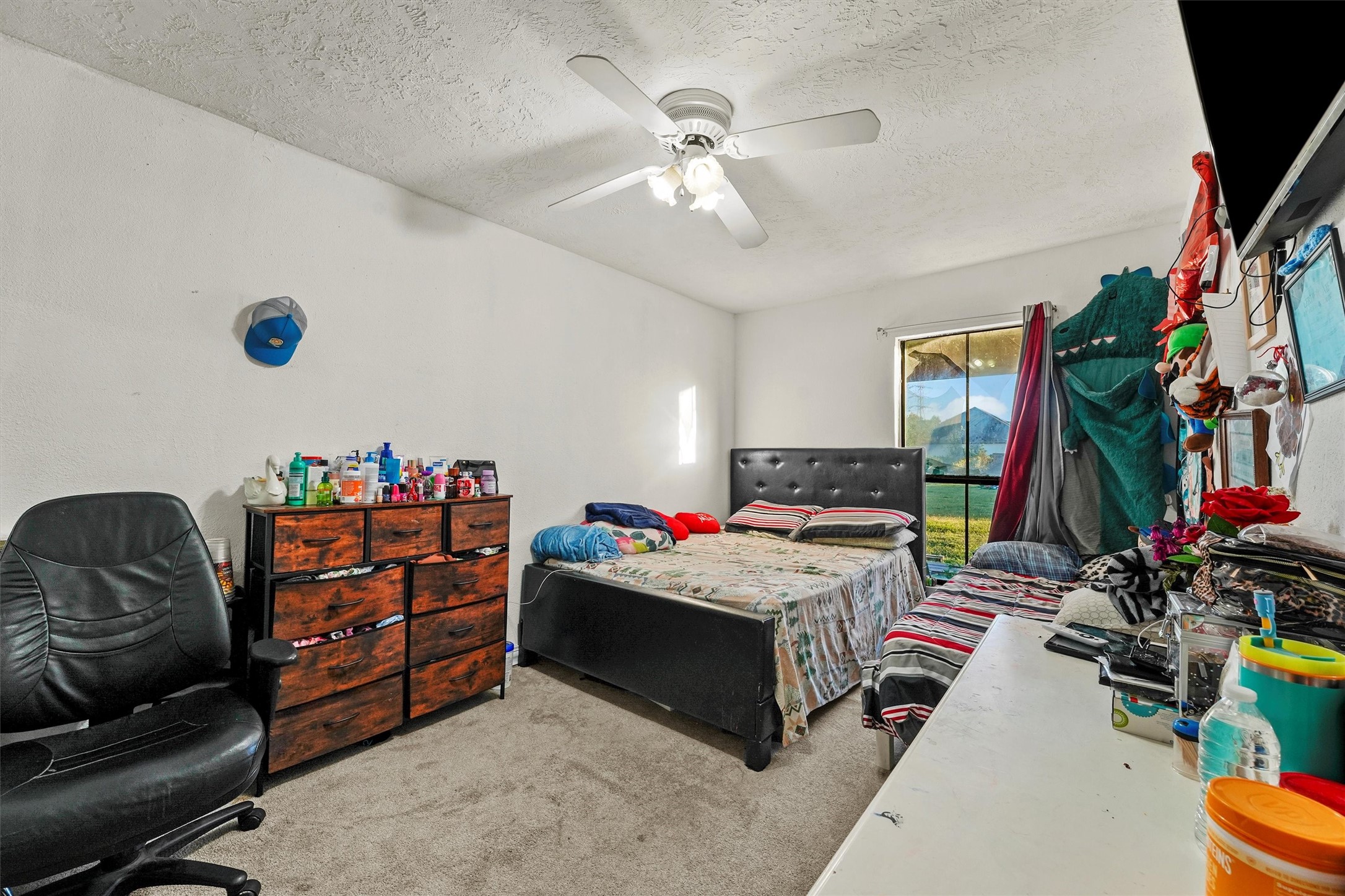 4322 Bennington Street Houston, TX 77016 - Photo 7 of 26 a bedroom with furniture and a flat screen tv
