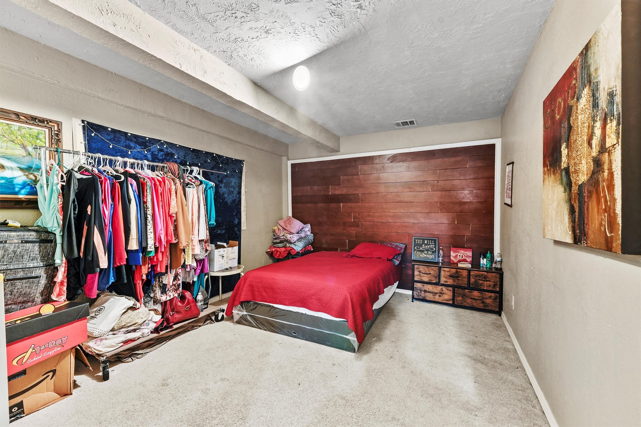 4322 Bennington Street Houston, TX 77016 - Photo 10 of 26 a view of a room with clothes and shoes