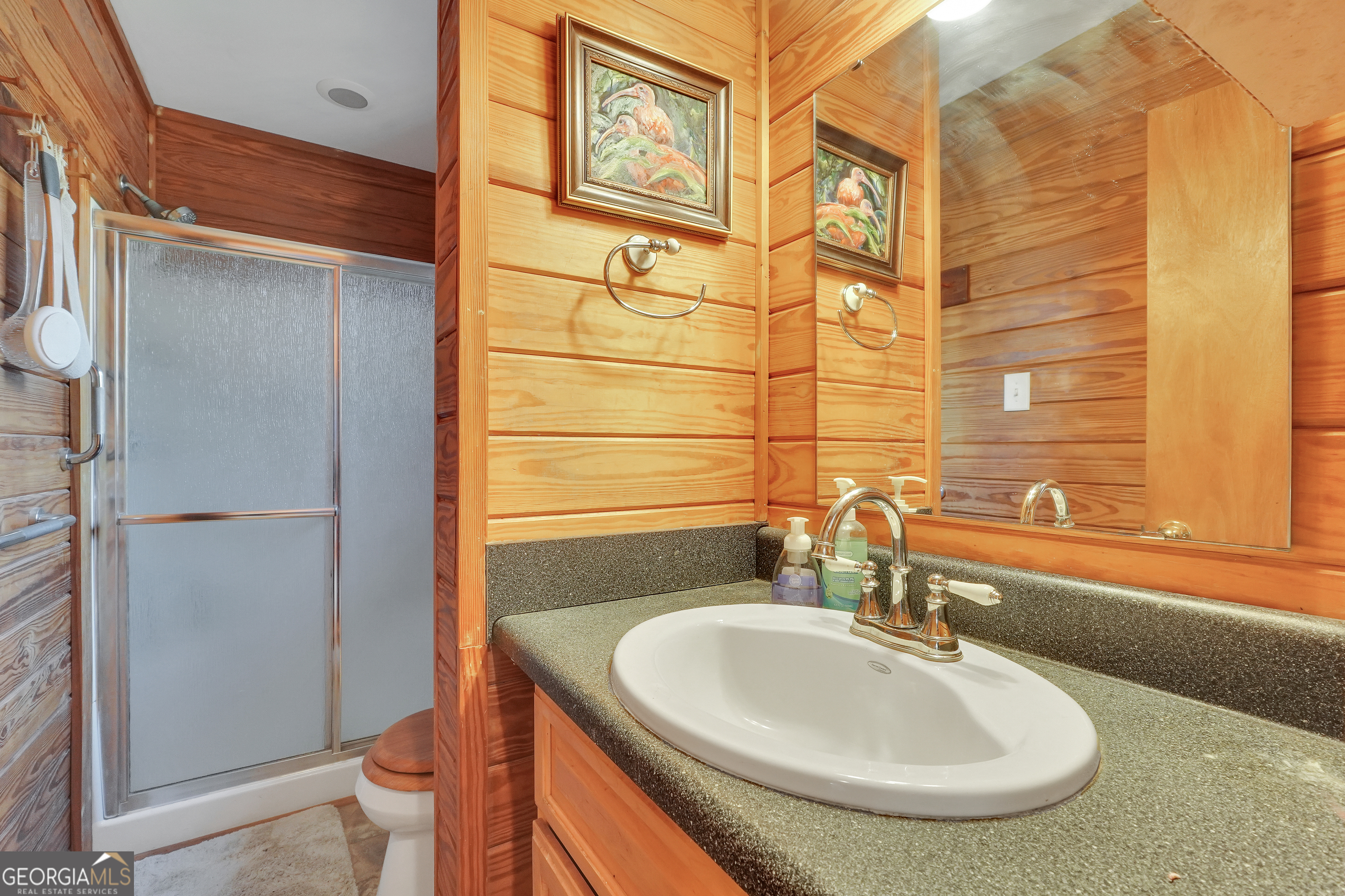 330 Country Kitchen Road Barnesville, GA 30204 - Photo 44 of 64 a bathroom with a sink and a large mirror