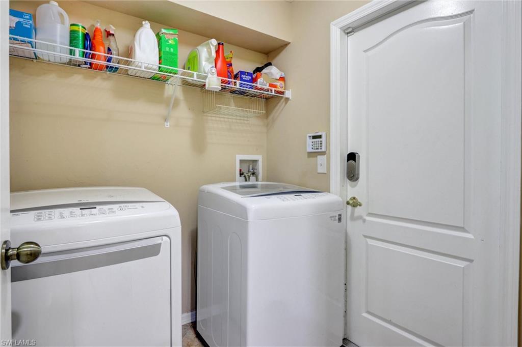 314 Rand Avenue Lehigh Acres, FL 33974 - Photo 10 of 35 a utility room with dryer and washer