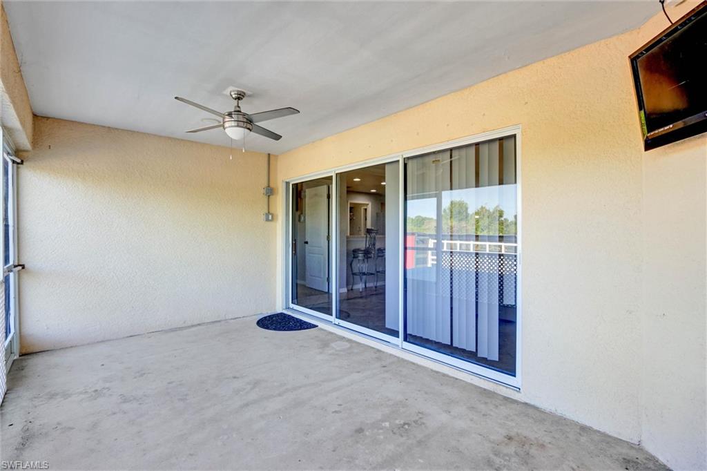 314 Rand Avenue Lehigh Acres, FL 33974 - Photo 21 of 35 a view of a livingroom with a flat screen tv