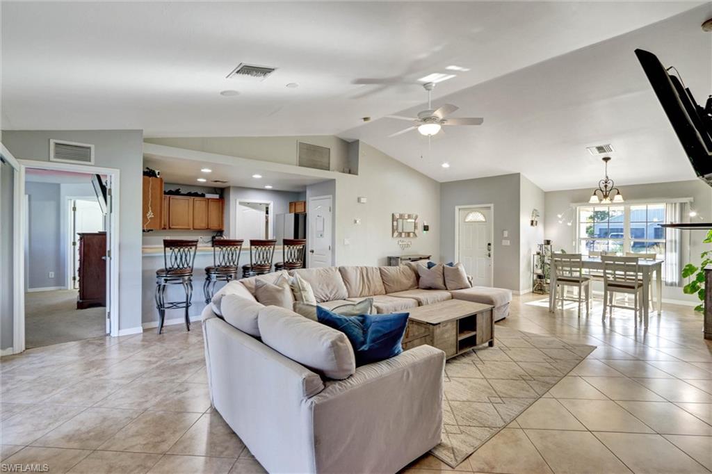 314 Rand Avenue Lehigh Acres, FL 33974 - Photo 3 of 35 a living room with furniture and a large window