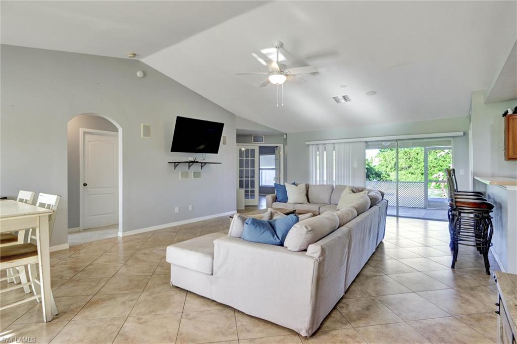 314 Rand Avenue Lehigh Acres, FL 33974 - Photo 5 of 35 a living room with furniture and a flat screen tv
