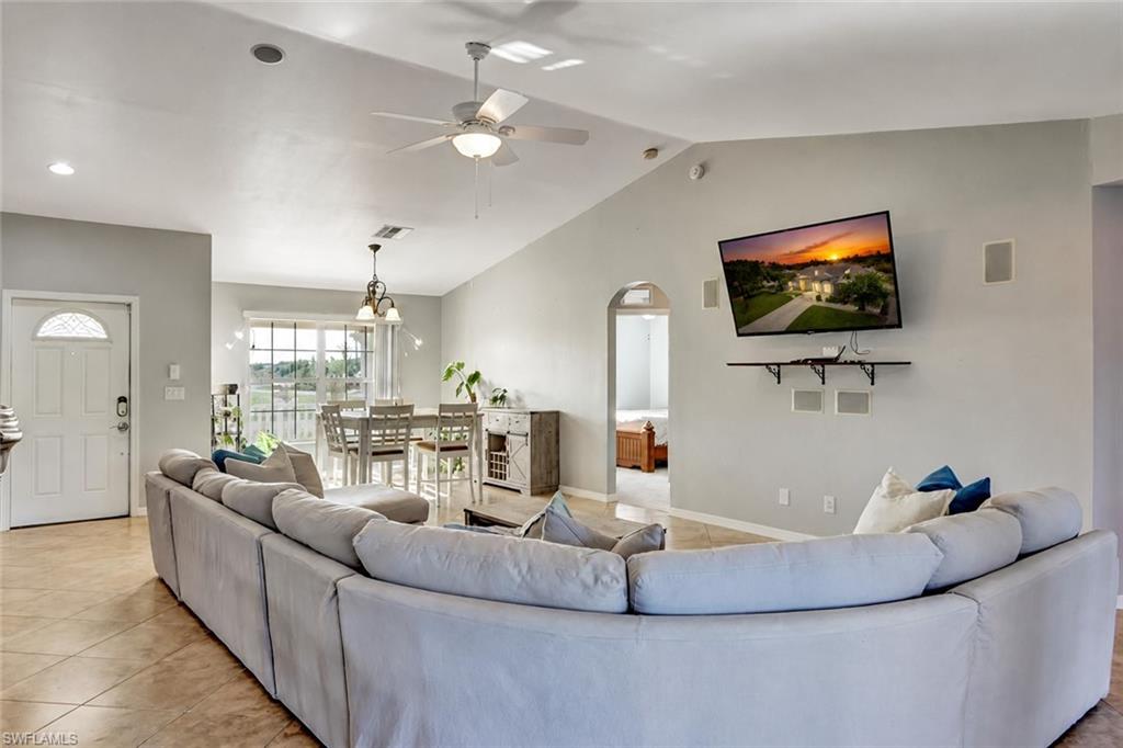 314 Rand Avenue Lehigh Acres, FL 33974 - Photo 8 of 35 a living room with furniture and a flat screen tv
