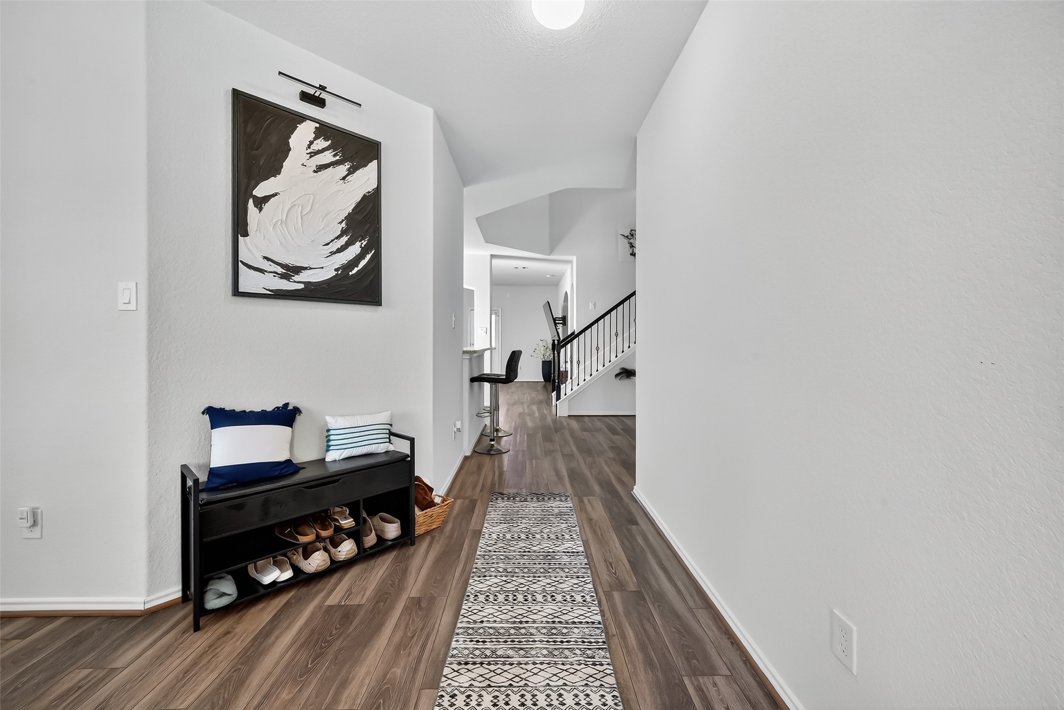 1601 Darwin Cedar Drive Rosharon, TX 77583 - Photo 10 of 44 a hallway with wooden floor and shoes
