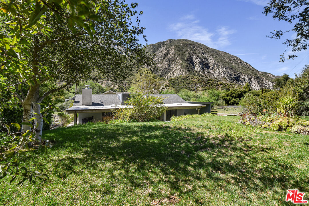 2447 Stonyvale Road Tujunga, CA 91042 - Photo 26 of 33 a view of a house with a yard