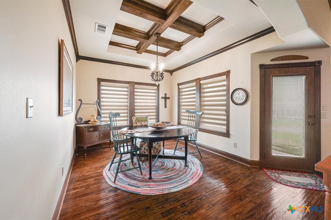 615 Benchmark Trail Belton, TX 76513 - Photo 18 of 36 a view of a dining room with furniture window and wooden floor