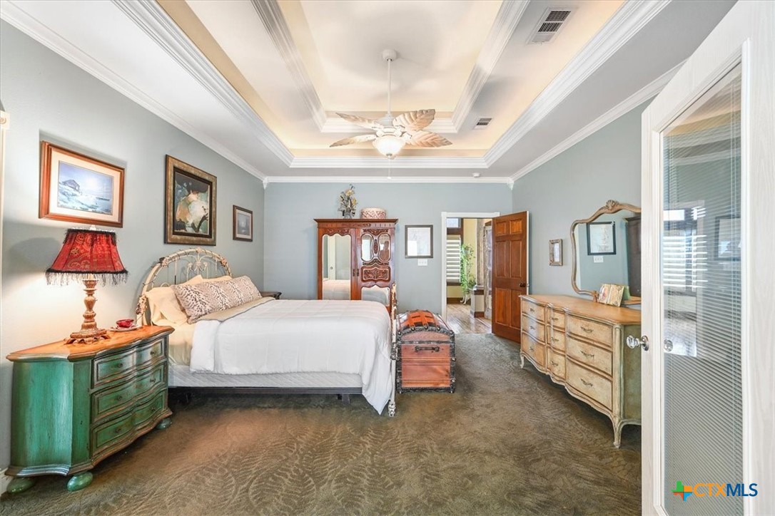 615 Benchmark Trail Belton, TX 76513 - Photo 20 of 36 a bedroom with a bed and a cabinets