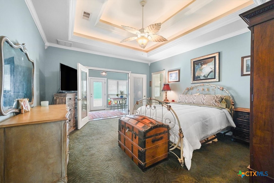 615 Benchmark Trail Belton, TX 76513 - Photo 22 of 36 a bedroom with a bed and a flat screen tv