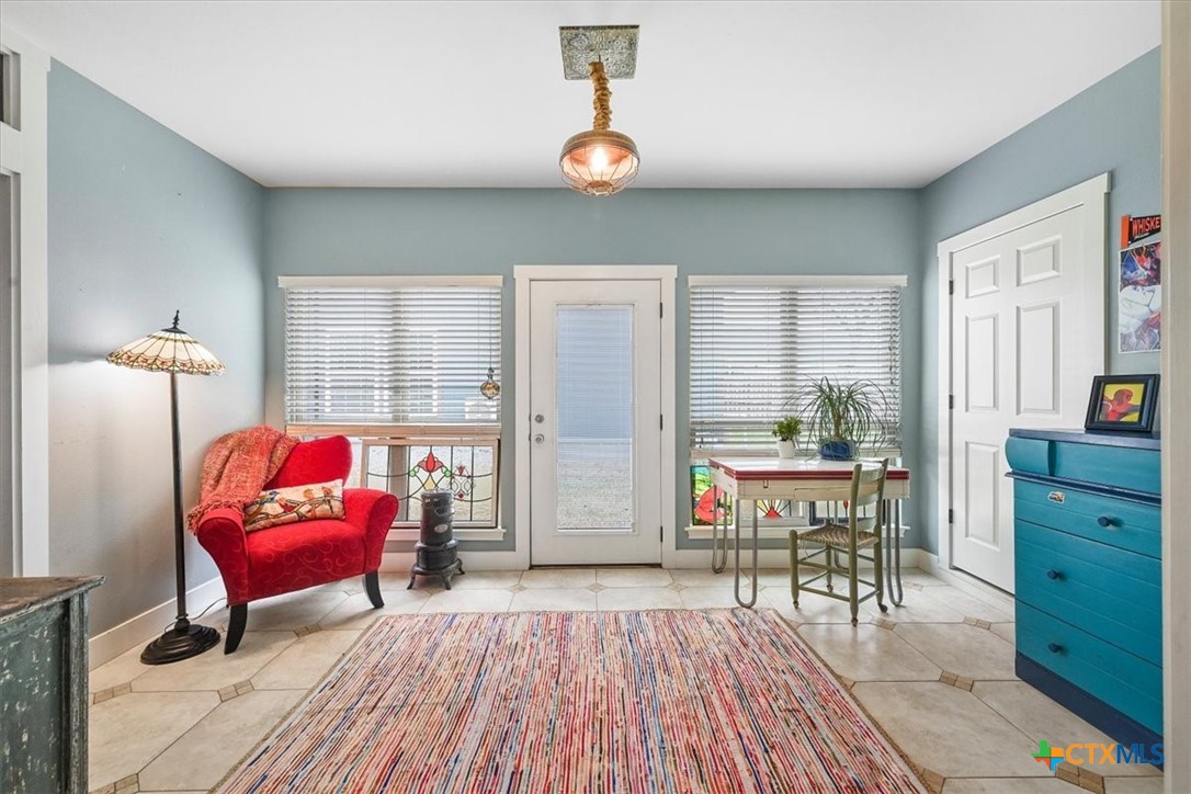 615 Benchmark Trail Belton, TX 76513 - Photo 24 of 36 a living room with furniture and a table