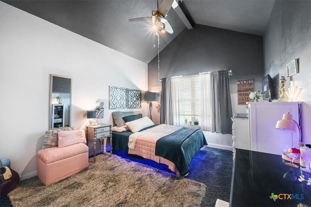 615 Benchmark Trail Belton, TX 76513 - Photo 29 of 36 a bedroom with a bed furniture and a chandelier