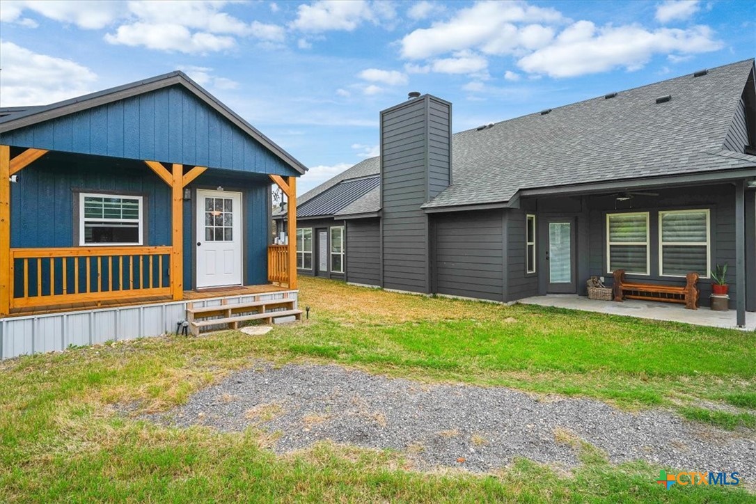 615 Benchmark Trail Belton, TX 76513 - Photo 31 of 36 a front view of a house with a yard and potted plants