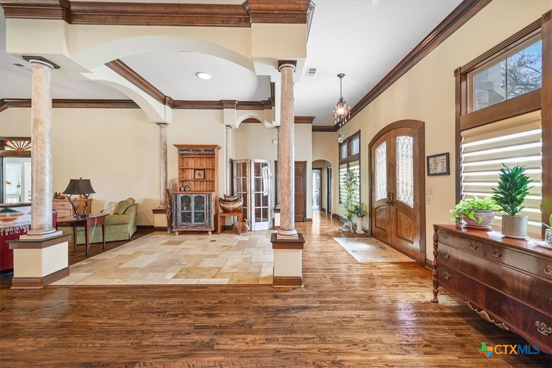 615 Benchmark Trail Belton, TX 76513 - Photo 10 of 36 a living room with fireplace furniture and a large window