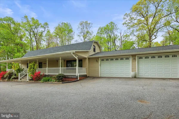 a view of a house with a big yard