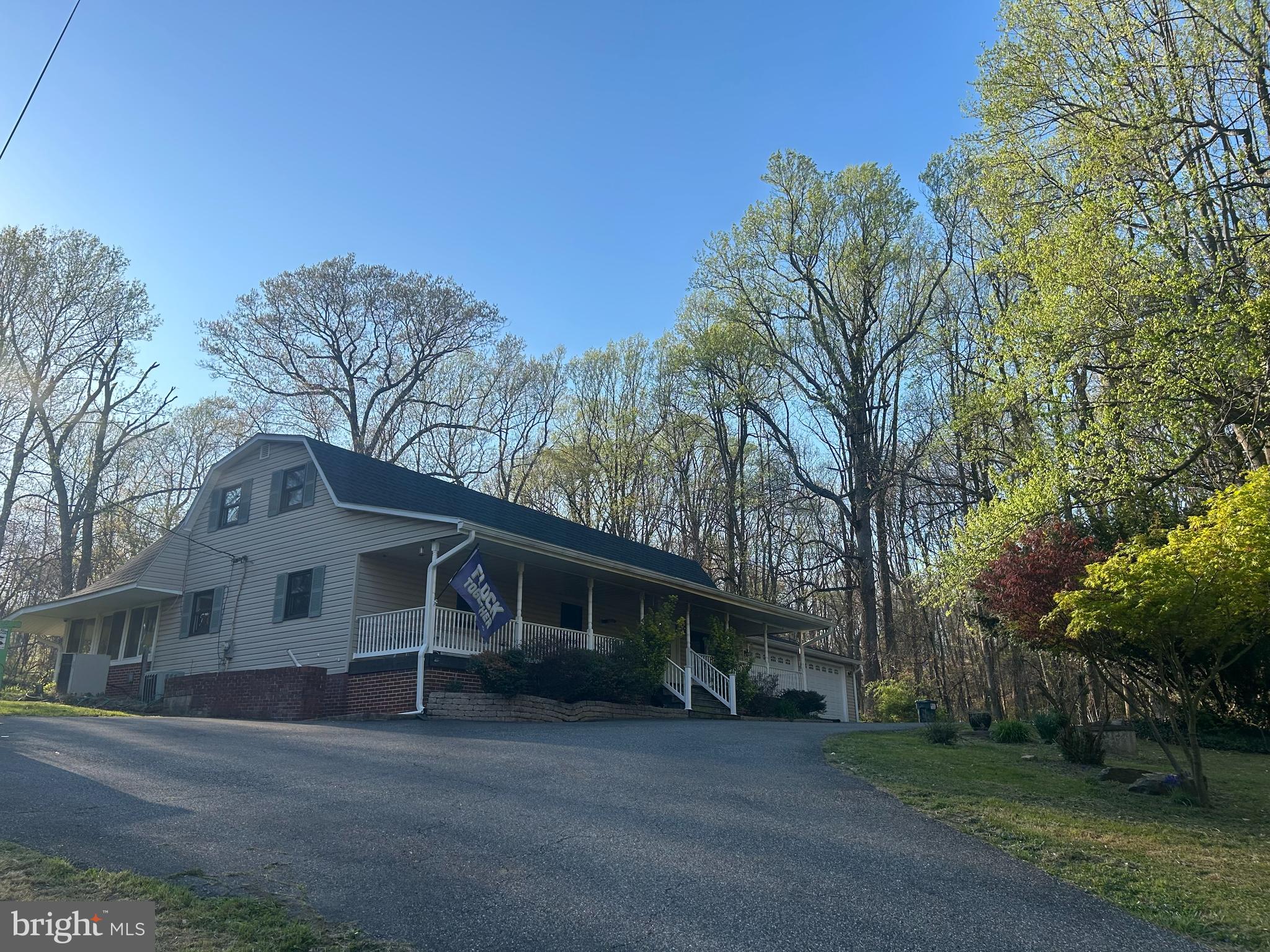 1426 Ridge Road Whiteford, MD 21160 - Photo 2 of 7 a view of a house with a large tree and a yard