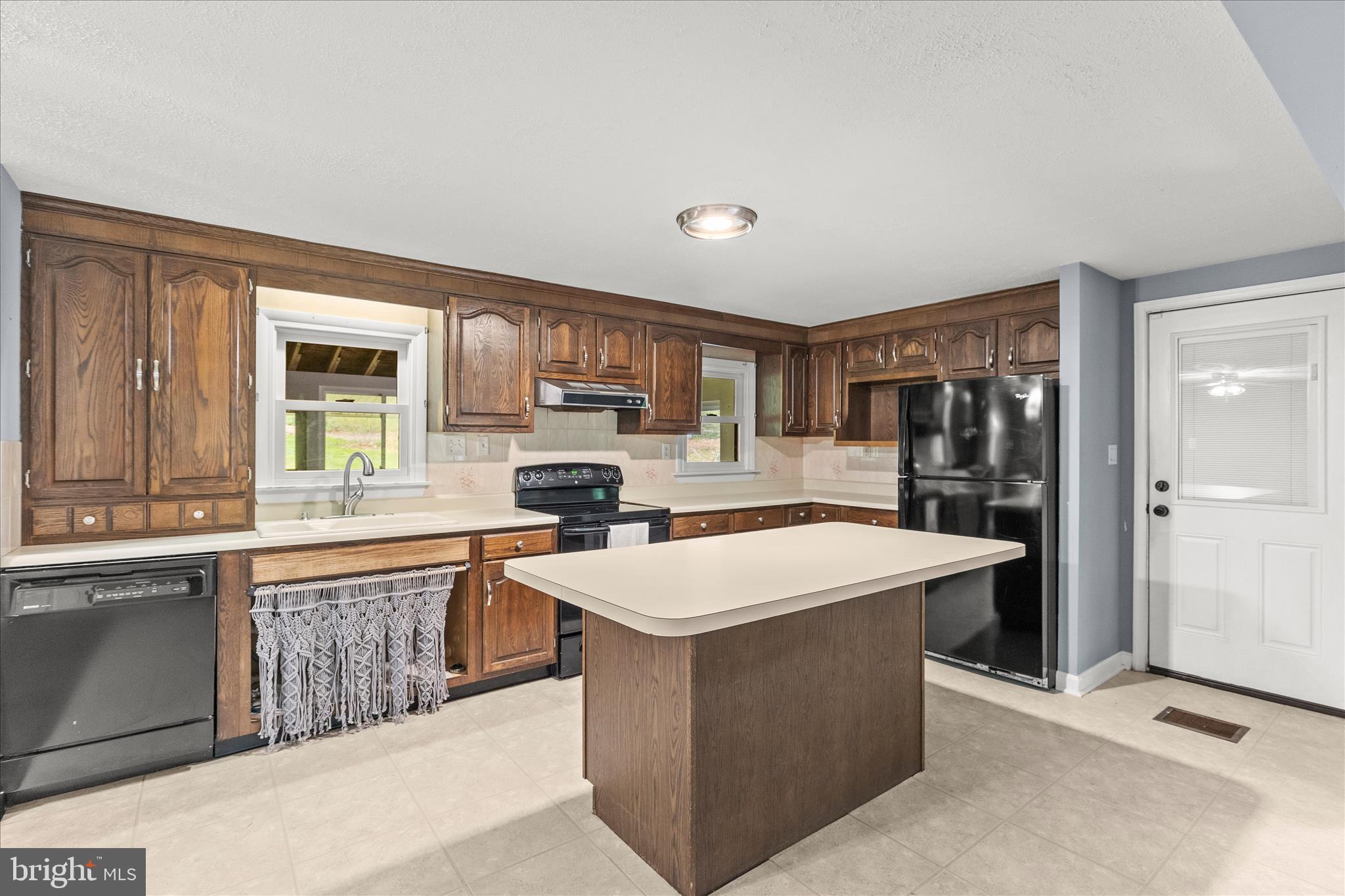 1426 Ridge Road Whiteford, MD 21160 - Photo 10 of 58 Kitchen with large island and wood cabinetry
