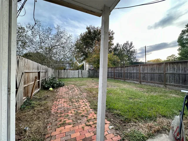 a view of a backyard with a garden