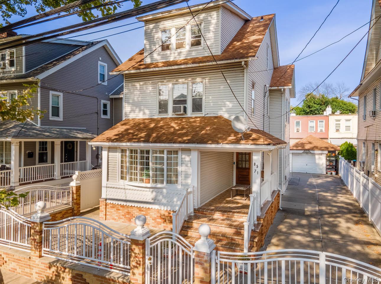 85-71 88th Street Queens, NY 11421 - Photo 1 of 1 front view of a house with a small yard