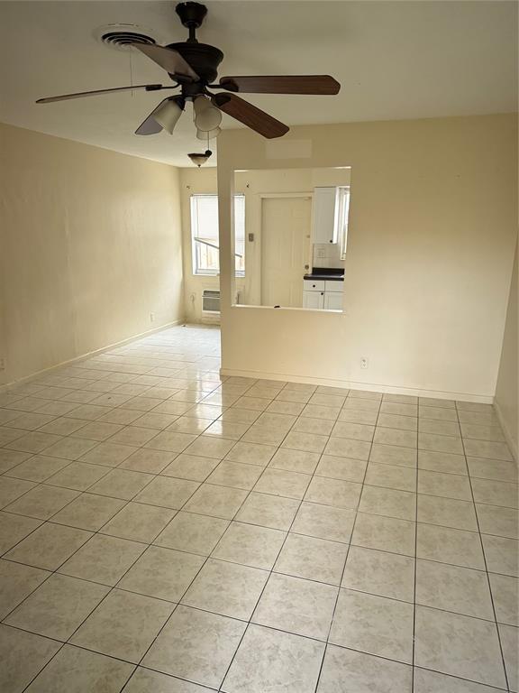 1477 Northwest 60th Avenue, Unit 2 Sunrise, FL 33313 - Photo 3 of 7 a view of an empty room and window