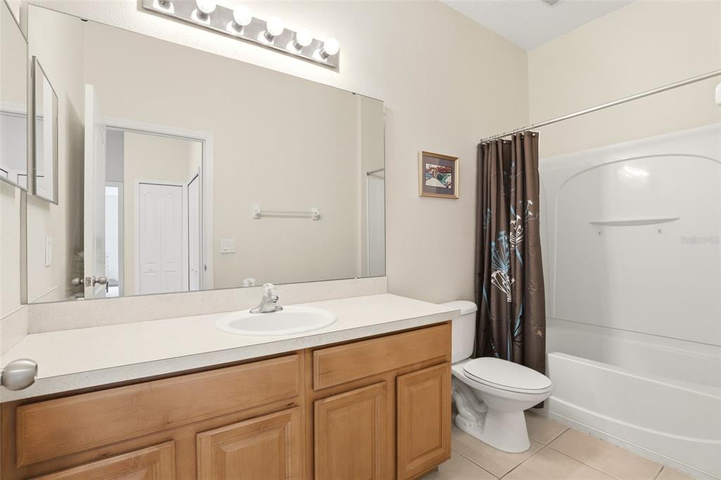 6458 South Goldenrod Road, Unit 29B Orlando, FL 32822 - Photo 24 of 40 a bathroom with a sink a toilet and shower