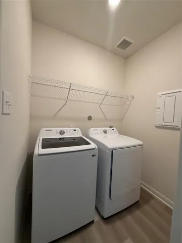 a utility room with dryer and washer