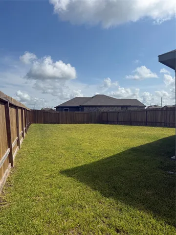 a view of an ocean and a yard