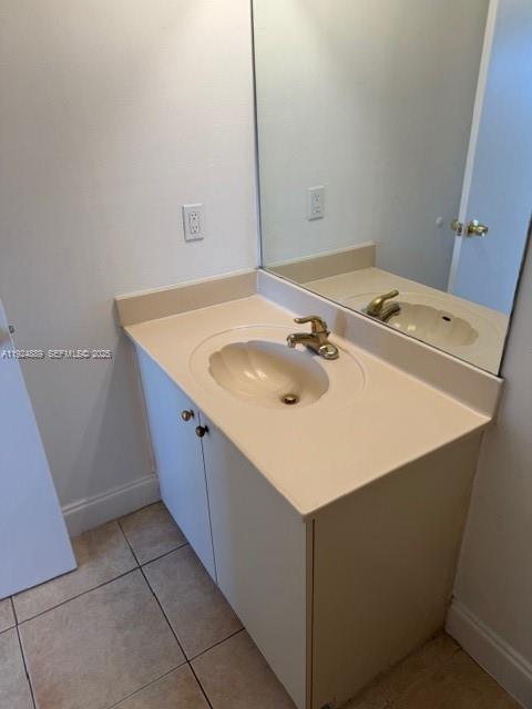 12960 Southwest 66th Lane, Unit 1031 Miami, FL 33183 - Photo 6 of 7 a room with a sink a washer and dryer