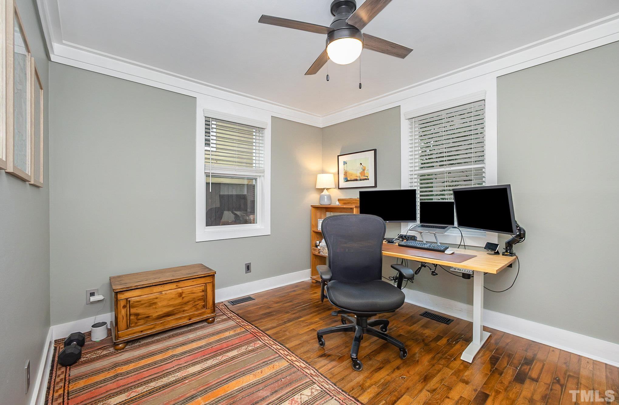 719 New Road Raleigh, NC 27608 - Photo 11 of 38 a workspace with furniture and a window