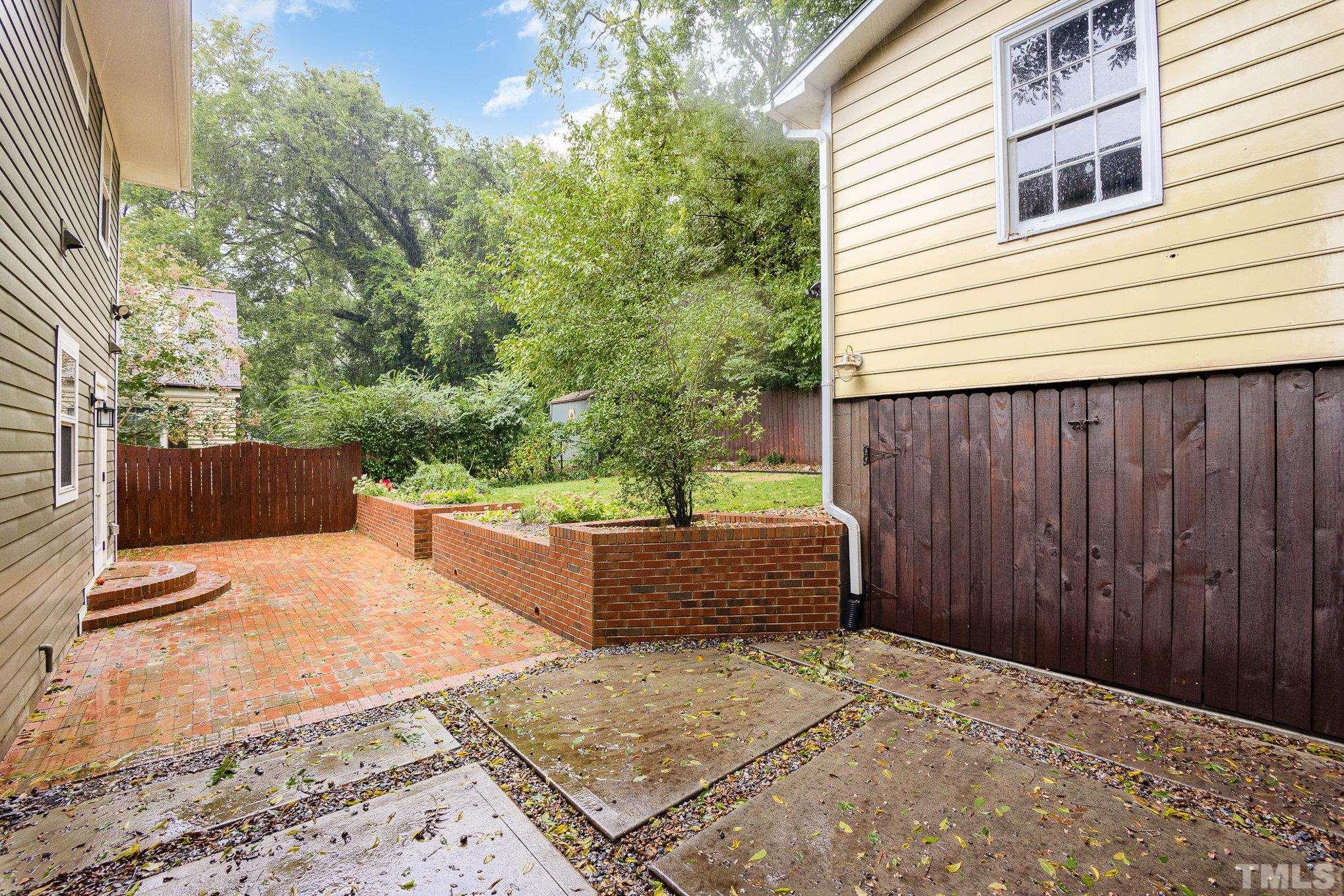 719 New Road Raleigh, NC 27608 - Photo 29 of 38 a view of a backyard with sitting area