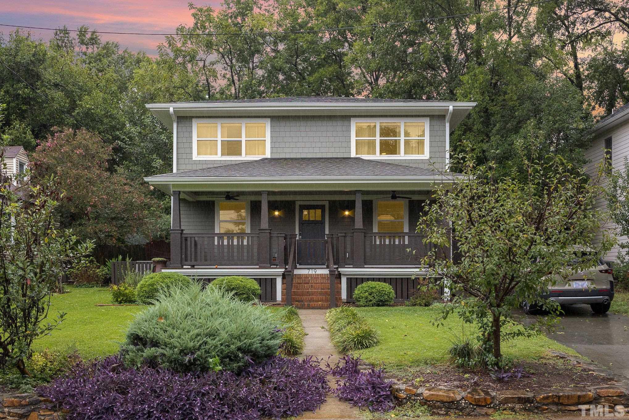 719 New Road Raleigh, NC 27608 - Photo 3 of 38 a front view of a house with garden