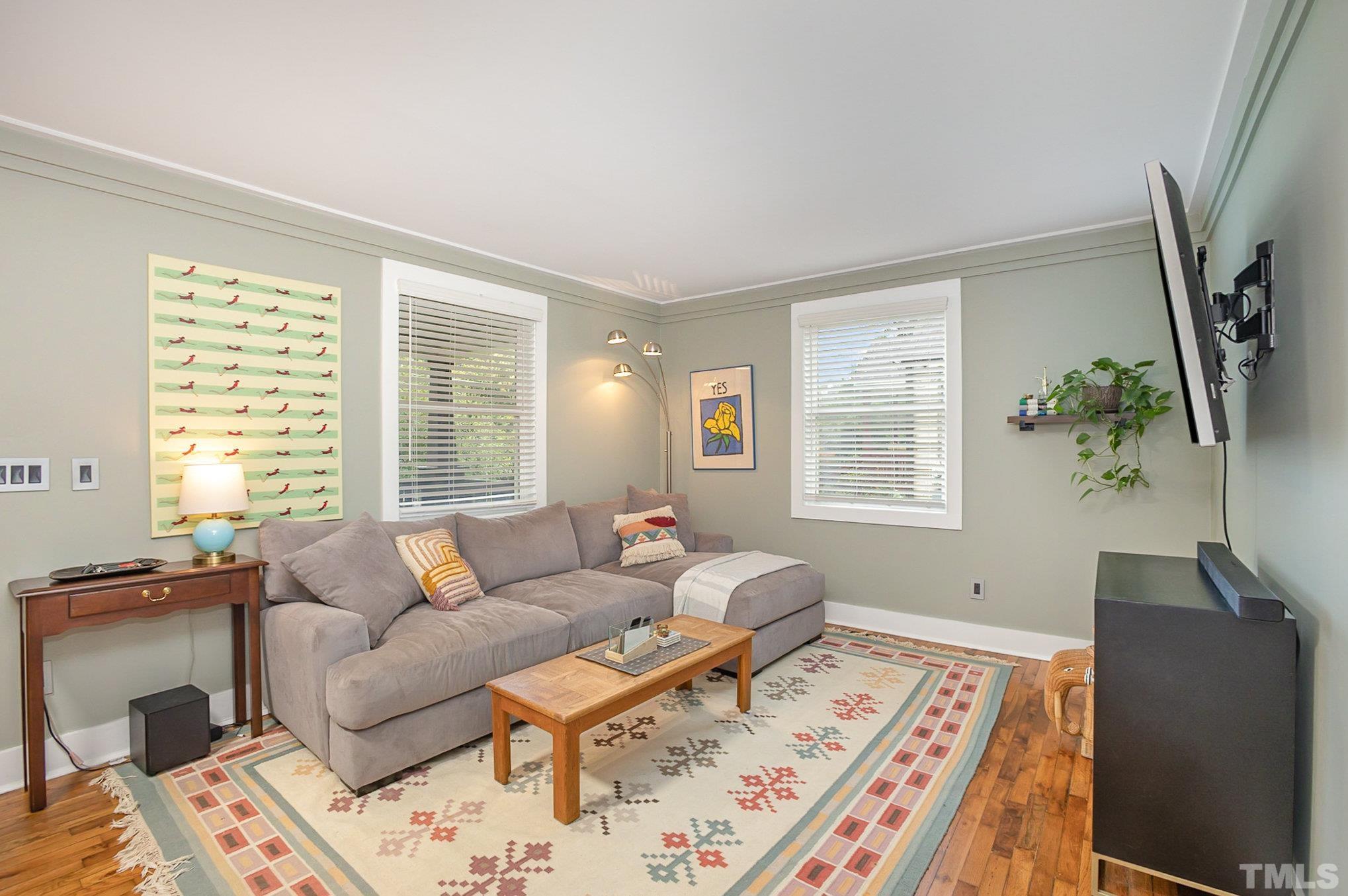719 New Road Raleigh, NC 27608 - Photo 8 of 38 a living room with furniture and a window