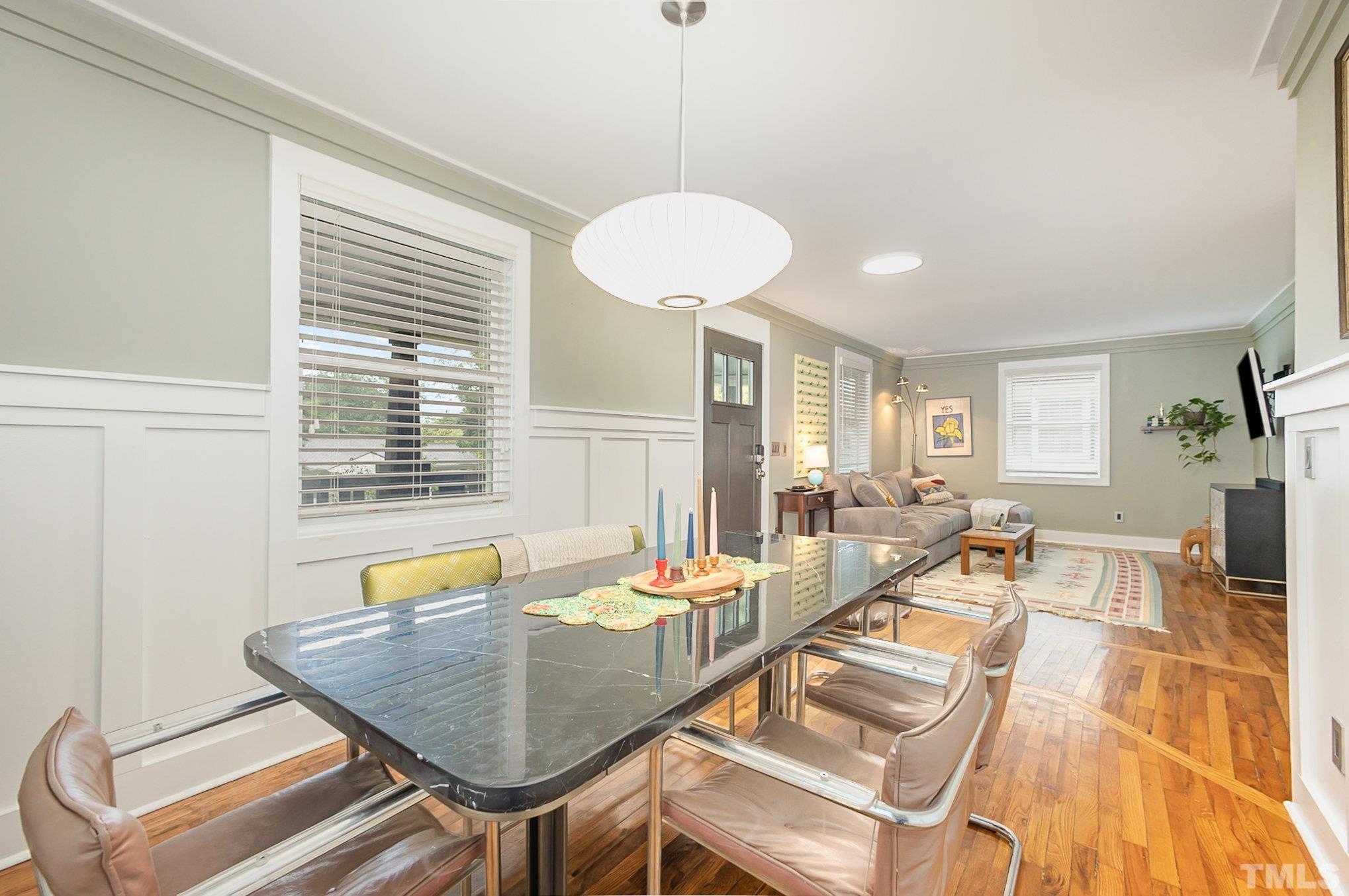 719 New Road Raleigh, NC 27608 - Photo 10 of 38 a view of a dining room with furniture and a window
