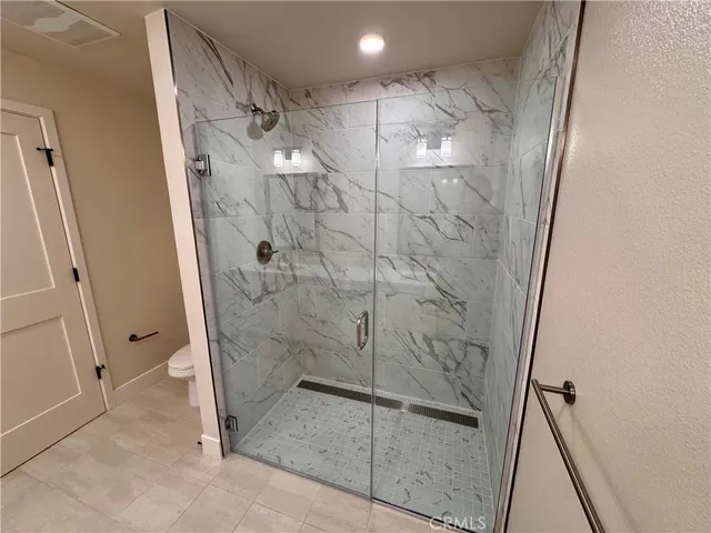 a bathroom with a double vanity sink and mirror