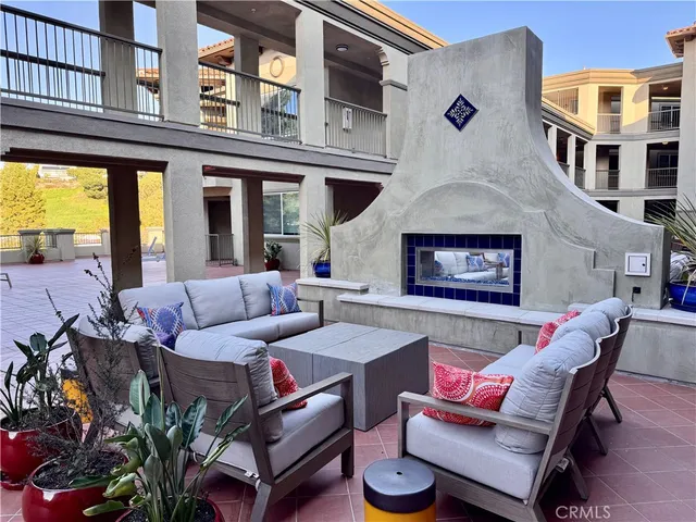 a backyard of a house with outdoor seating